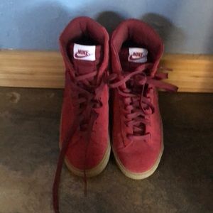 Maroon suede Nike high tops with gum bottom